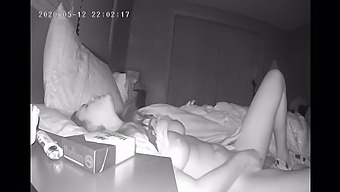 A Reserved Young Woman Pleasures Herself In Bed With A Hidden Camera